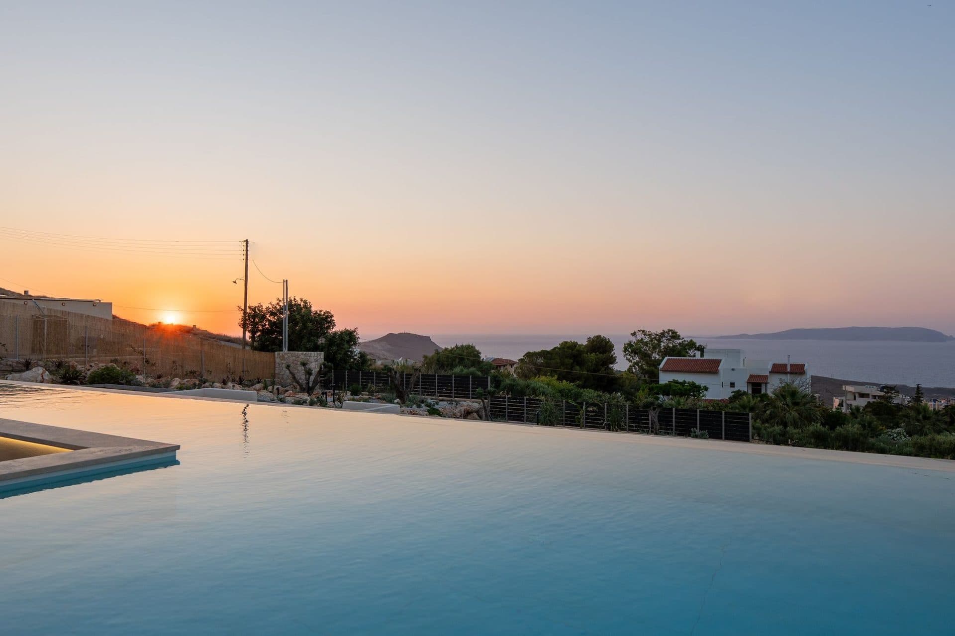 Villa with private infinity pool at sunset in Crete